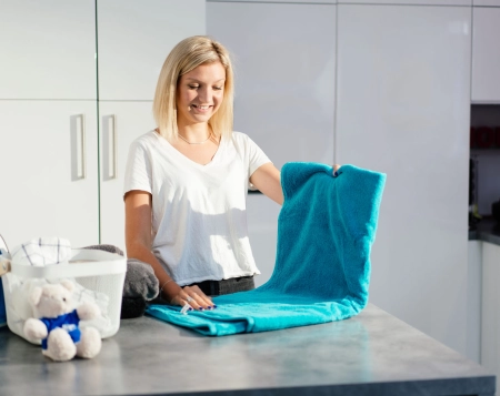 Quelles sont les précautions de dosage des produits lessiviels avec un adoucisseur ?